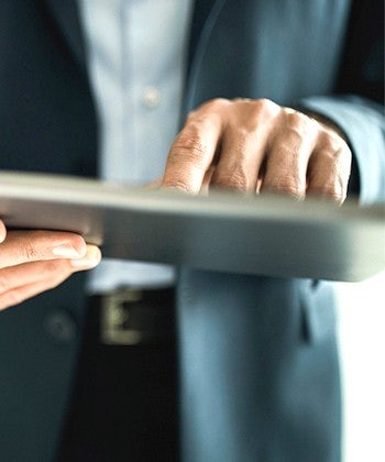 man holding his tablet