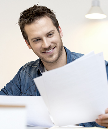 man looking to papers