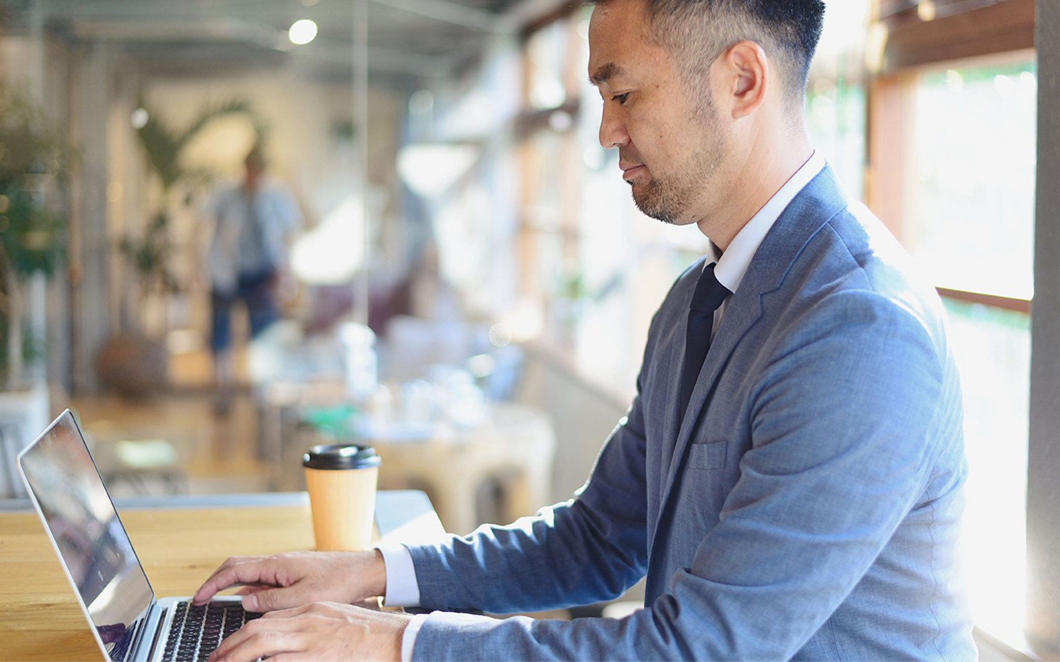 man typing on a keyboard