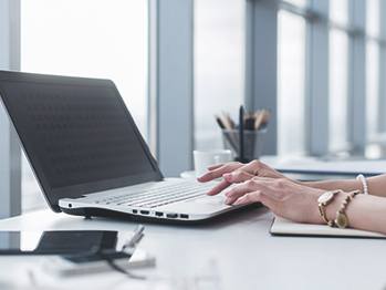Content Services hands on laptop